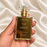 30ml Plaque Perfume Wedding Favours held in a neatly manicured hand on ivory satin