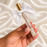 10ml Perfume Vial Wedding Favours held in a neatly manicured hand on ivory satin