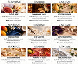 A grid of nine product labels for Sun Daze candles, each featuring a unique name, scent profile, and mood description. The labels display imagery of fruits, flowers, and fabrics, with text detailing notes like vanilla, mango, pear, and amber.